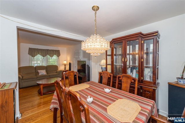 55 Rowland Ave, Hackensack, NJ 07601 - dining room featuring a chandelier and wood finished floors