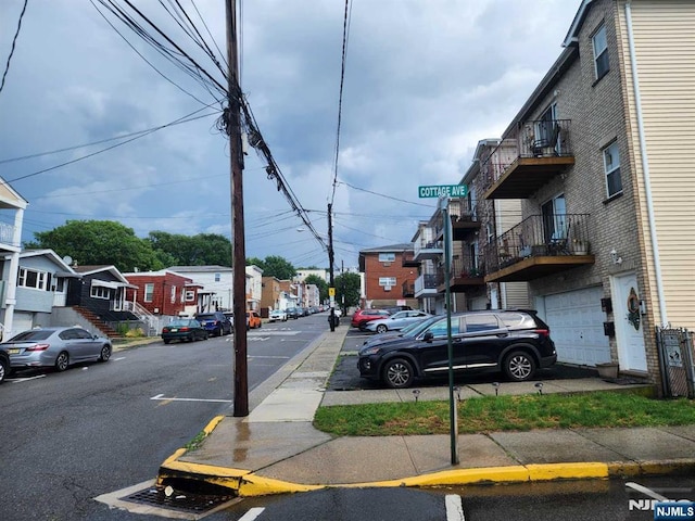 4311 Cottage Ave, North Bergen, NJ 07047 - view of asphalt road with sidewalks, a residential view, and curbs