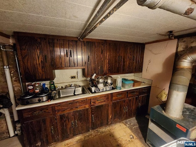 4311 Cottage Ave, North Bergen, NJ 07047 - kitchen featuring light countertops and dark brown cabinetry