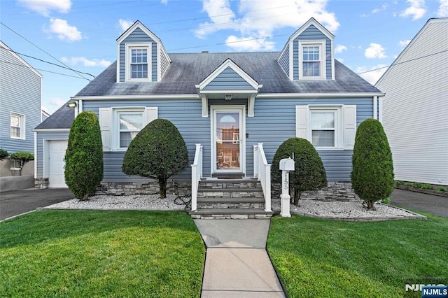 155 Bergen Ave, North Arlington, NJ 07031 - new england style home featuring a front lawn, roof with shingles, and asphalt driveway
