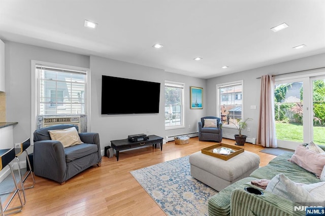 203 Central Ave, Bogota, NJ 07603 - living room with light wood-style floors, a baseboard heating unit, and recessed lighting