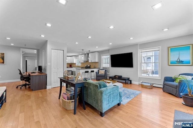 203 Central Ave, Bogota, NJ 07603 - living area featuring an office area, light wood-type flooring, a baseboard heating unit, and recessed lighting