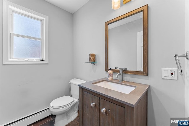 203 Central Ave, Bogota, NJ 07603 - bathroom featuring a baseboard radiator, vanity, and tile patterned flooring