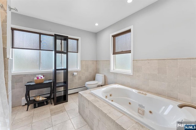 203 Central Ave, Bogota, NJ 07603 - bathroom with tile walls, a whirlpool tub, tile patterned floors, recessed lighting, and wainscoting