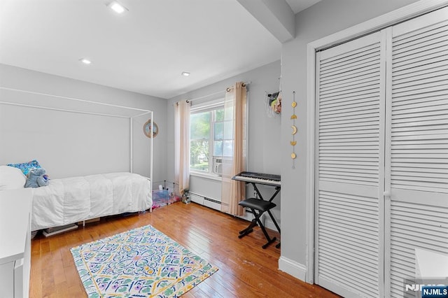 203 Central Ave, Bogota, NJ 07603 - bedroom featuring wood-type flooring, recessed lighting, and a closet