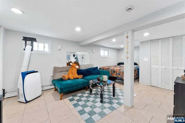 203 Central Ave, Bogota, NJ 07603 - living area featuring a baseboard radiator, recessed lighting, light tile patterned flooring, and plenty of natural light