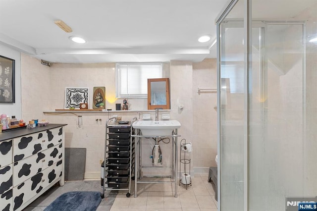 203 Central Ave, Bogota, NJ 07603 - full bathroom with tile patterned floors, a shower stall, tile walls, and recessed lighting