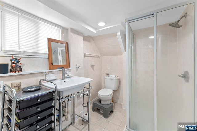 203 Central Ave, Bogota, NJ 07603 - bathroom featuring tile walls, tile patterned flooring, and a stall shower