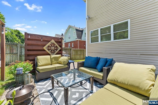 203 Central Ave, Bogota, NJ 07603 - fenced backyard featuring outdoor lounge area and a patio