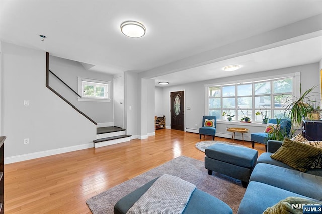 203 Central Ave, Bogota, NJ 07603 - living room with stairs, baseboard heating, and light wood-type flooring