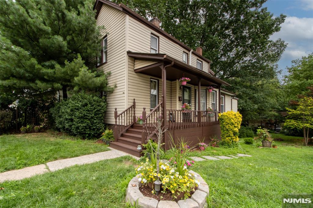 260 Lincoln St, East Orange, NJ 07017 - view of front of property featuring a porch, a chimney, and a front yard