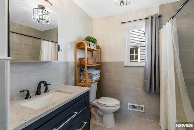 9 Westervelt Pl, Irvington, NJ 07111 - bathroom with tile walls, vanity, and curtained shower