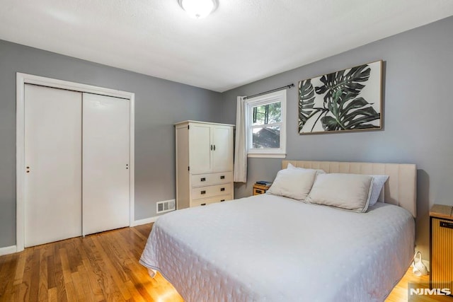 9 Westervelt Pl, Irvington, NJ 07111 - bedroom with wood finished floors, a closet, and radiator heating unit