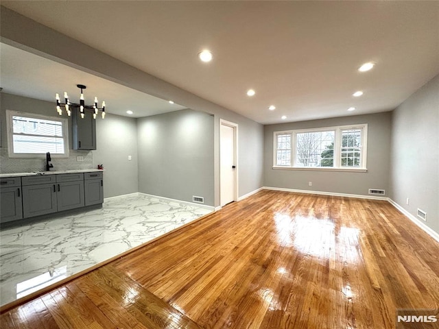 9 Westervelt Pl, Irvington, NJ 07111 - interior space featuring recessed lighting, a chandelier, and light wood-style flooring