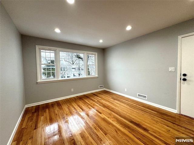 9 Westervelt Pl, Irvington, NJ 07111 - unfurnished room with wood finished floors and recessed lighting