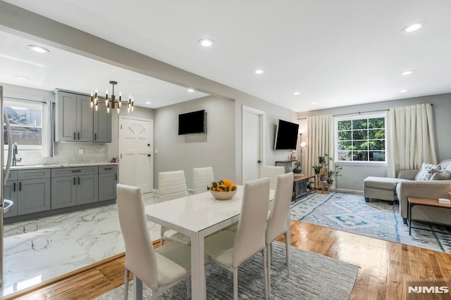 9 Westervelt Pl, Irvington, NJ 07111 - dining space featuring recessed lighting, a chandelier, and light wood finished floors