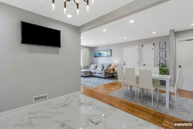 9 Westervelt Pl, Irvington, NJ 07111 - dining space featuring recessed lighting, marble finish flooring, and a chandelier