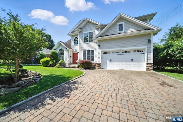 6 Highland Ave, Demarest, NJ 07627 - view of front of house with decorative driveway, stone siding, a front yard, and an attached garage