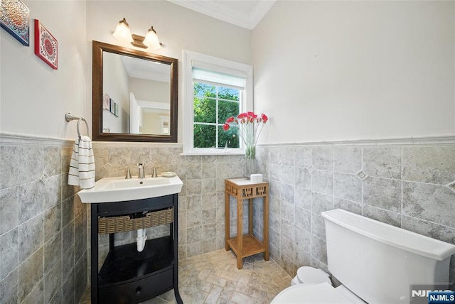 6 Highland Ave, Demarest, NJ 07627 - half bathroom with tile walls, crown molding, wainscoting, and vanity