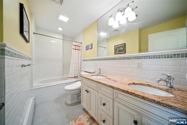 6 Highland Ave, Demarest, NJ 07627 - full bath with tile walls, tiled shower / bath combo, double vanity, tile patterned flooring, and a wainscoted wall