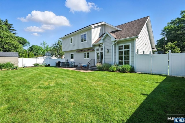 6 Highland Ave, Demarest, NJ 07627 - rear view of property featuring a fenced backyard, a patio area, and roof with shingles
