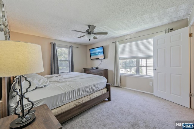 1066 Ash Dr, Mahwah, NJ 07430 - bedroom featuring carpet flooring, ceiling fan, and a textured ceiling