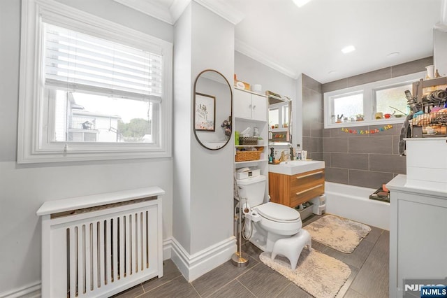 79 Newark Ave, Bloomfield, NJ 07003 - bathroom featuring radiator, a bathtub, vanity, and ornamental molding