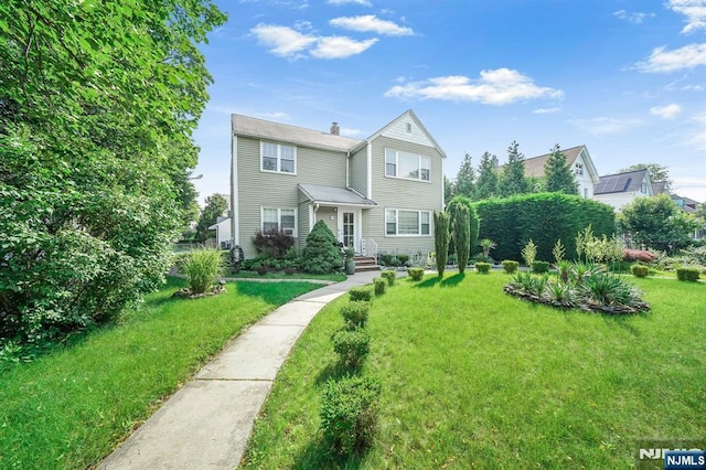 79 Newark Ave, Bloomfield, NJ 07003 - view of front of home with a front lawn and a chimney