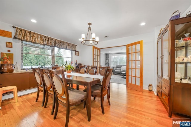 79 Newark Ave, Bloomfield, NJ 07003 - dining area featuring light wood-type flooring, a chandelier, french doors, recessed lighting, and baseboard heating