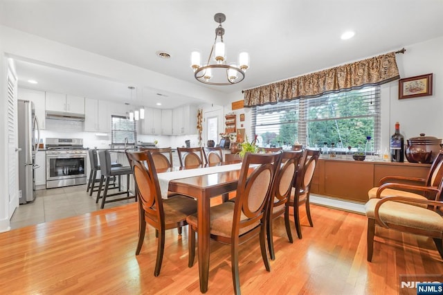 79 Newark Ave, Bloomfield, NJ 07003 - dining area featuring a chandelier, recessed lighting, light wood-type flooring, and baseboard heating
