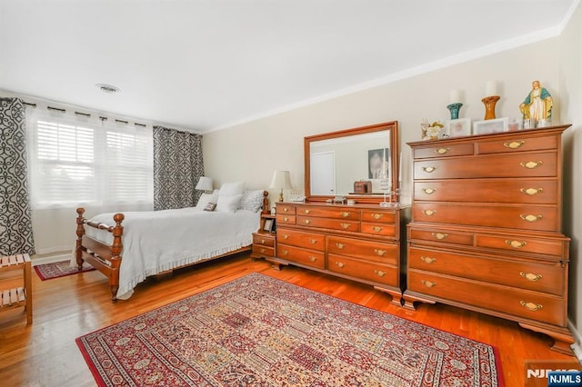 79 Newark Ave, Bloomfield, NJ 07003 - bedroom with crown molding and light wood-style flooring