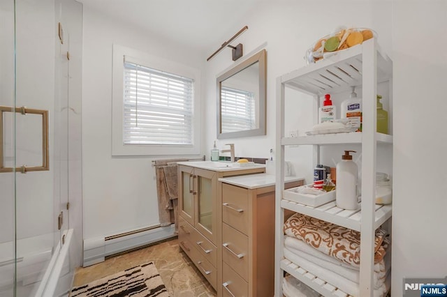 79 Newark Ave, Bloomfield, NJ 07003 - full bath featuring baseboard heating, vanity, and combined bath / shower with glass door