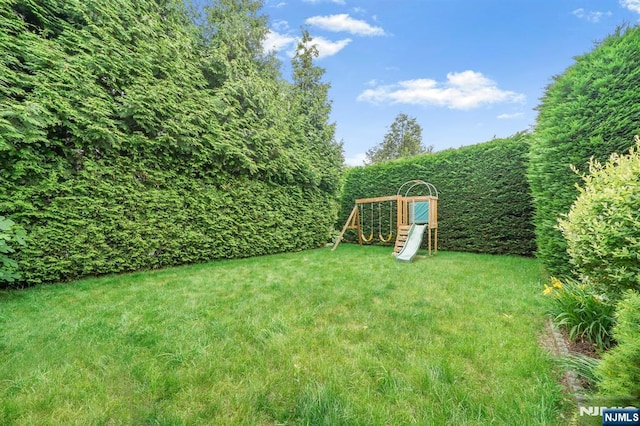 79 Newark Ave, Bloomfield, NJ 07003 - view of grassy yard with a playground