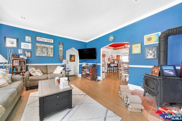 79 Newark Ave, Bloomfield, NJ 07003 - living room with a wood stove, ornamental molding, and wood finished floors
