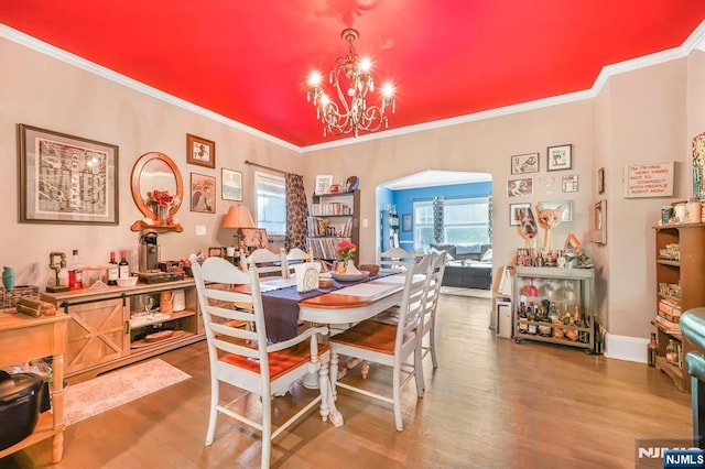 79 Newark Ave, Bloomfield, NJ 07003 - dining area featuring a chandelier, wood finished floors, and crown molding