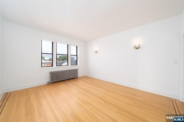 1100 83rd St Unit 301, North Bergen, NJ 07047 - empty room featuring radiator heating unit and light wood finished floors