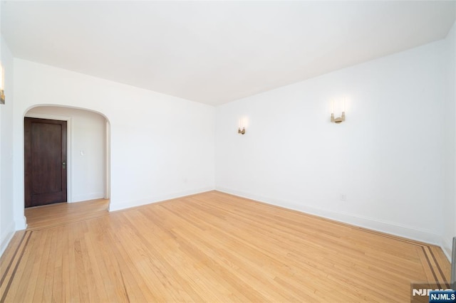 1100 83rd St Unit 301, North Bergen, NJ 07047 - unfurnished room featuring arched walkways and light wood-style flooring