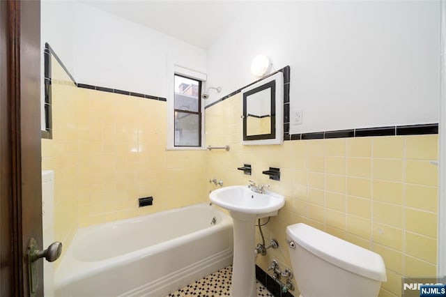 1100 83rd St Unit 301, North Bergen, NJ 07047 - bathroom featuring a tub to relax in and tile walls