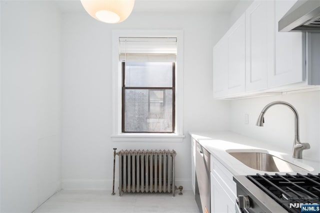 1100 83rd St Unit 301, North Bergen, NJ 07047 - kitchen featuring radiator heating unit, wall chimney range hood, white cabinetry, and dishwasher