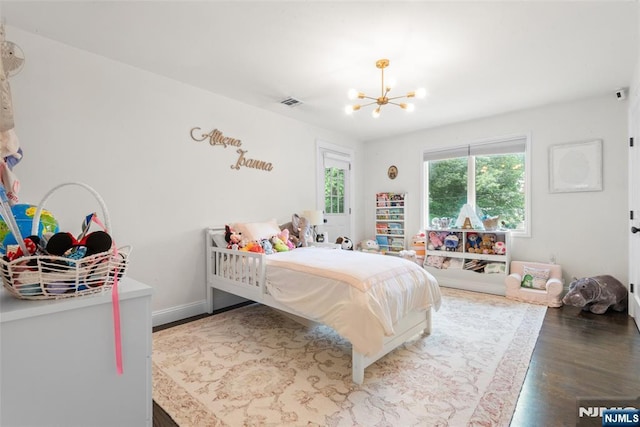 216 8th St, Cresskill, NJ 07626 - bedroom featuring a chandelier and wood finished floors