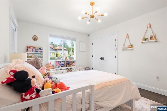 216 8th St, Cresskill, NJ 07626 - bedroom featuring a chandelier, wood finished floors, and a closet