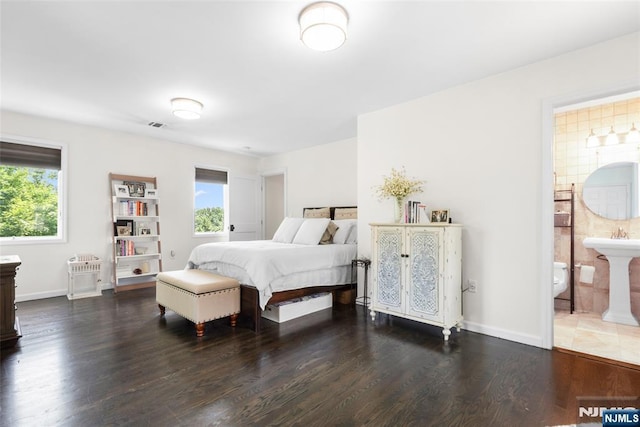 216 8th St, Cresskill, NJ 07626 - bedroom featuring multiple windows, dark wood-type flooring, and ensuite bathroom