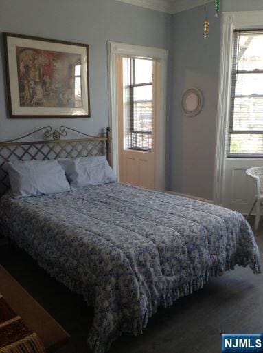 17 48th St, Weehawken, NJ 07086 - bedroom with multiple windows and crown molding