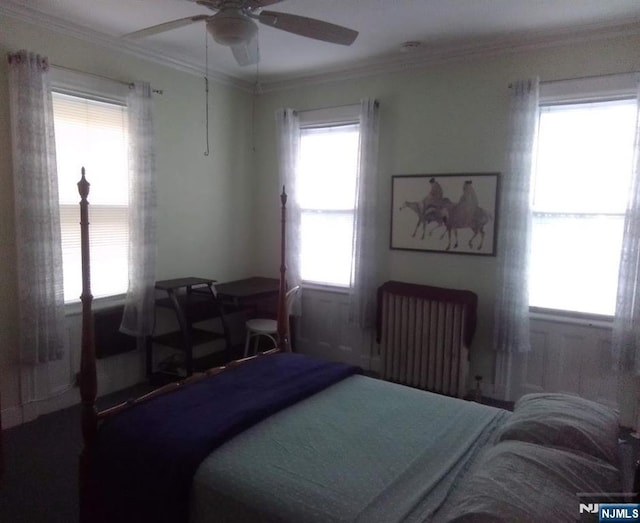 17 48th St, Weehawken, NJ 07086 - bedroom with radiator heating unit, crown molding, and ceiling fan