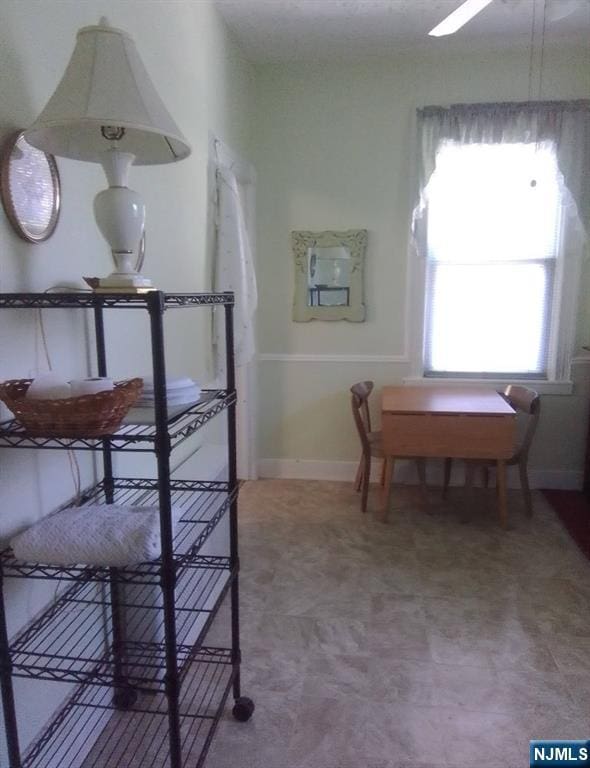 17 48th St, Weehawken, NJ 07086 - hallway featuring tile patterned floors