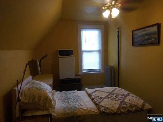 17 48th St, Weehawken, NJ 07086 - bedroom featuring radiator heating unit, lofted ceiling, and a ceiling fan