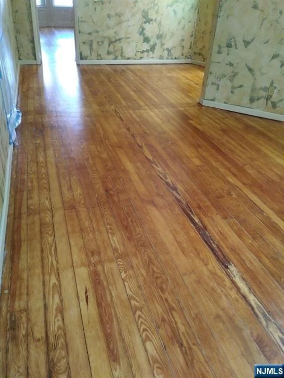 17 48th St, Weehawken, NJ 07086 - spare room featuring hardwood / wood-style flooring and baseboards