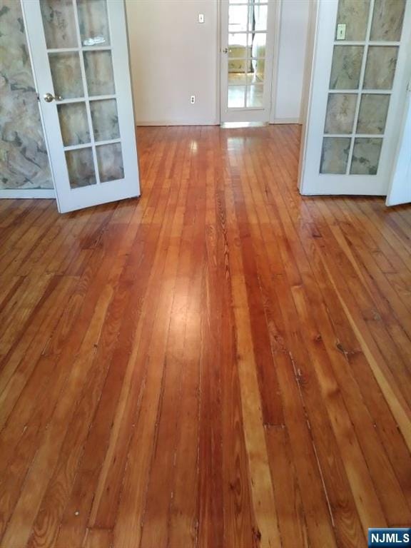 17 48th St, Weehawken, NJ 07086 - unfurnished room featuring wood-type flooring and french doors