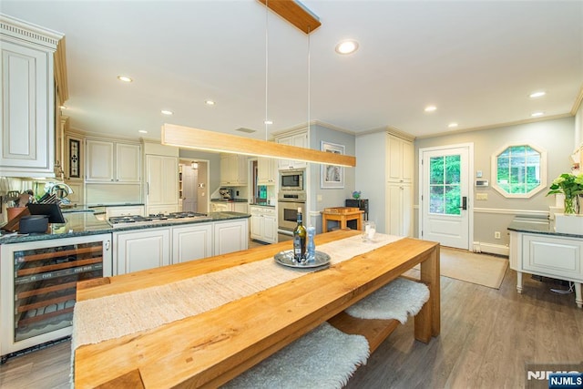 59 Green Hill Rd, Kinnelon Borough, NJ 07405 - dining area with beverage cooler, light wood-style flooring, recessed lighting, and crown molding