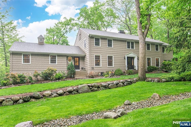 59 Green Hill Rd, Kinnelon Borough, NJ 07405 - colonial-style house with a chimney and a front yard